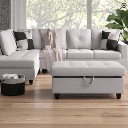 Light gray sectional couch with ottoman 