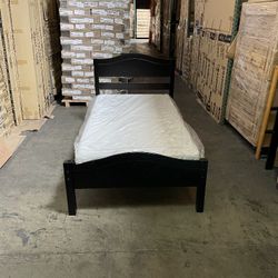 Twin espresso bed with twin 6" thick memory foam mattress.  Assembly required.  Assembly not included.  Tax included.  Free local delivery. -$199. 