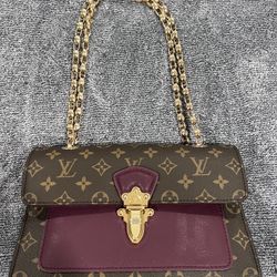 Louis Vuitton Victoire Leather Handbag