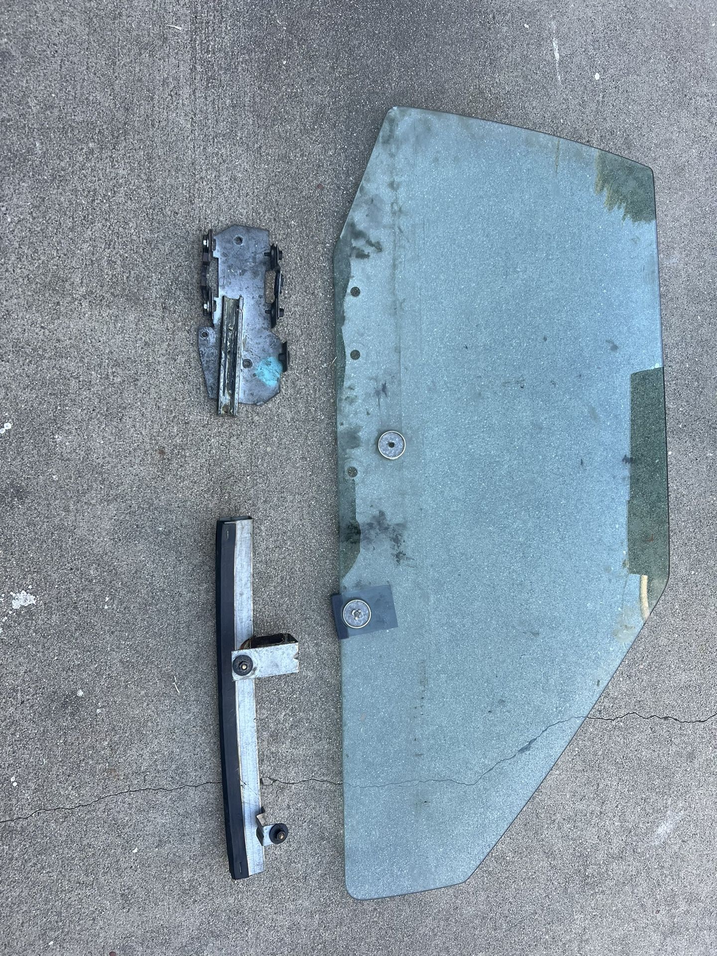 Passenger side windshield with some brackets Off A ‘92 Mustang