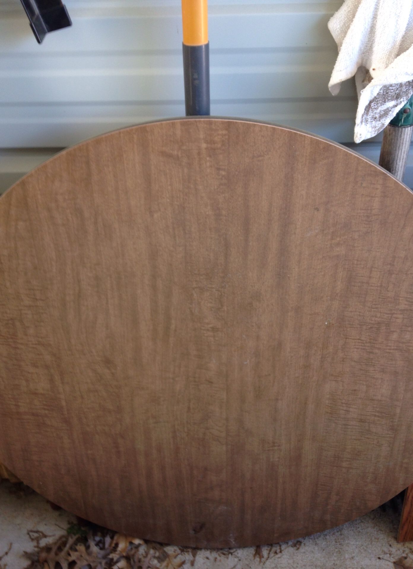 Small kitchen table and three stackable chairs and oak framed mirror.