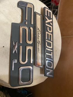 2 vintage Ford badges