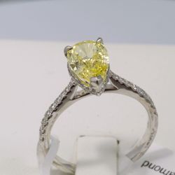  Pear Cut Fancy Vivid Yellow Diamond Ring with Pave accent stones.  IGI Certified lab grown