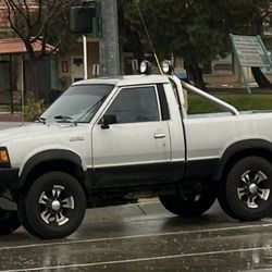 Rare 85' Nissan ST 4x4 Short Bed , 5 Speed , A/C , Power Steering , Auto Locking Hubs , 16" Rims W/ Falken All Terrain Tires