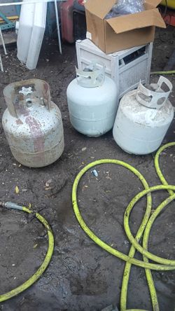 Three used propane tanks