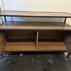 Real wood entertainment center with two doors on the front