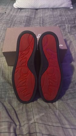 Christian Louboutin red bottoms low top