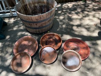 Large barrel planter; 6 planter base drains: 3 clay, 3 plastic