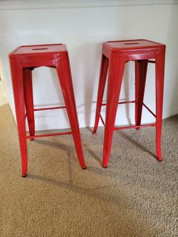 2 bar stools, red metal