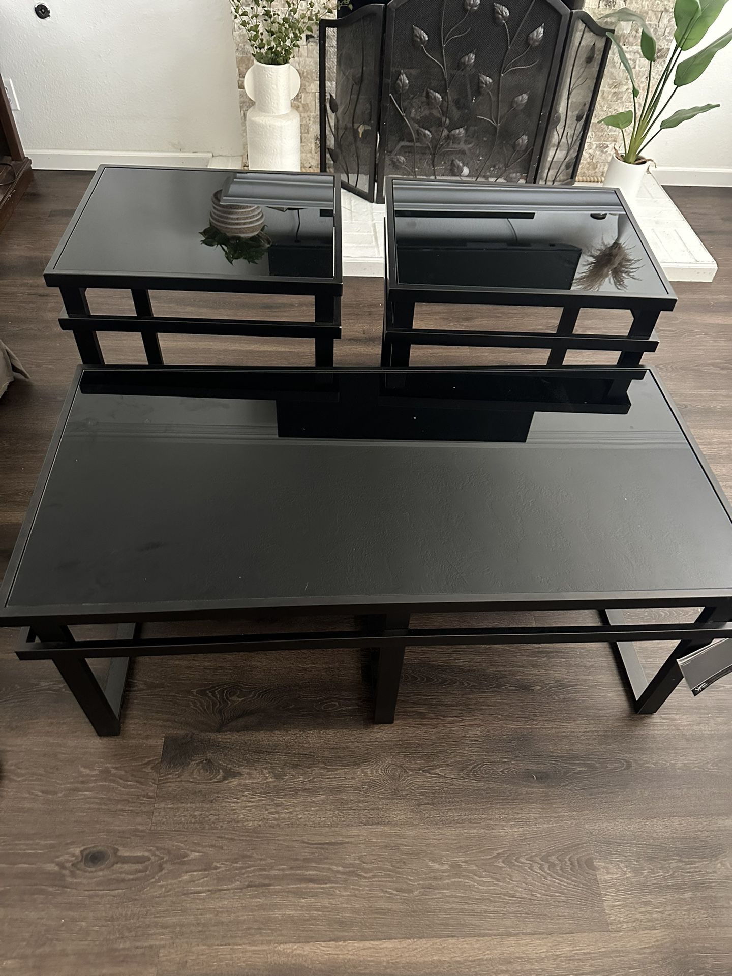 black glass table with side tables