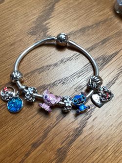 Stitch bracelet $80, stitch charm , Angel charm, hearts, Winnie Pooh charm, lilo and stitch