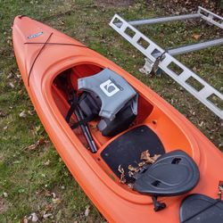 Kayak With Paddles and Life Jacket