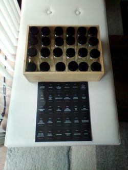 Spice jars set up in wood box