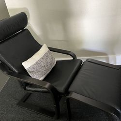 Pair of Ikea Poang black leather lounge chairs and ottomans 