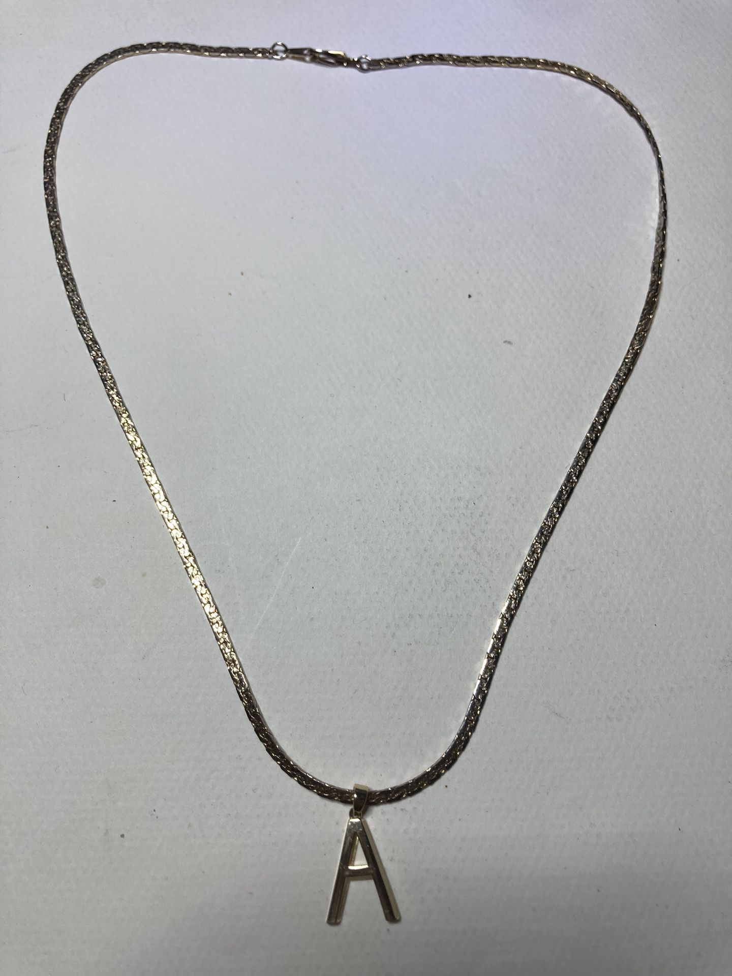 14kt gold necklace with “A” pendant