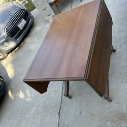 ANTIQUE DINING TABLE WITH WHEELS