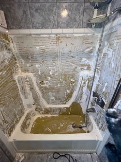Refinishing Fiberglass and tile bathtub repair