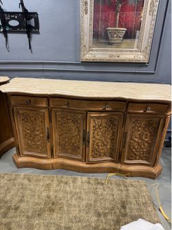 Mediterranean traditional stone-top credenza featuring intricate relief-carved cabinet doors - 86” x 25” x 42”