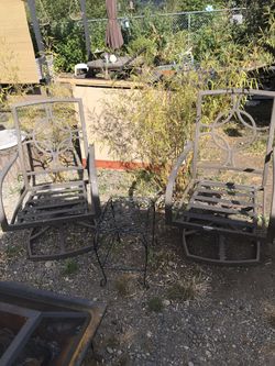 Two Large Swivel Metal Chairs