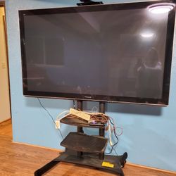 64" TV On Quality Mobile Stand - Perfect