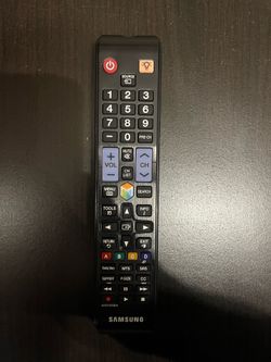 Samsung 40” LED Smart TV bundled with Apple TV streaming device, remote, and cables.