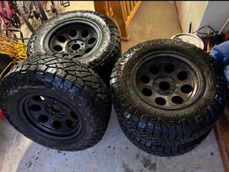 5 Nitto Ridge Grappler 33inch hybrid terrain tires on high end rims.