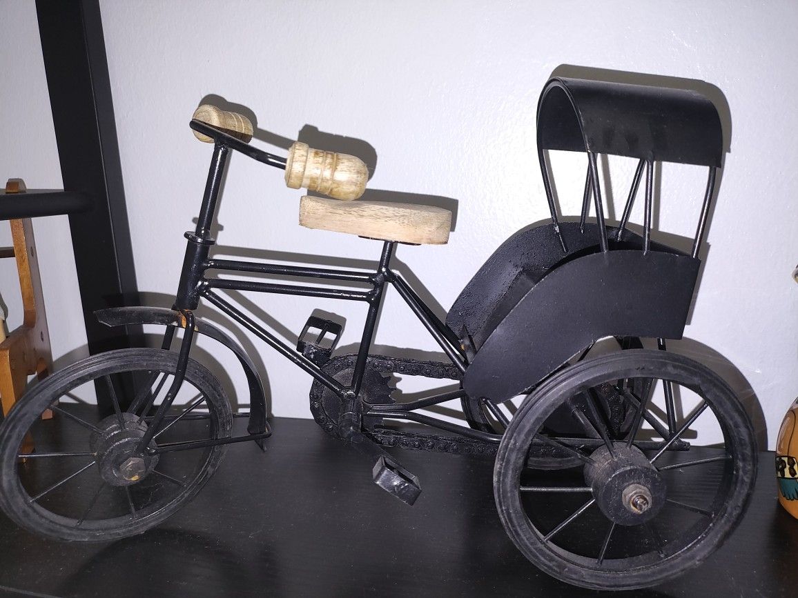 Doll On A Bench And Bicycle