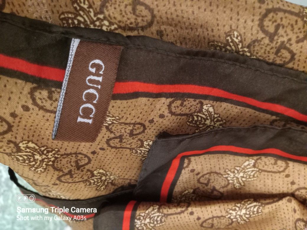 GUCCI  SILK  SCARF GG ICONIC GUCCI LOGO W/RED BLACK STRIPE  XLONG PRE-OWNED NO ISSUES GREAT CONDITION. YES STILL AVAILABLE 75060 AREA  SILK BROWN.