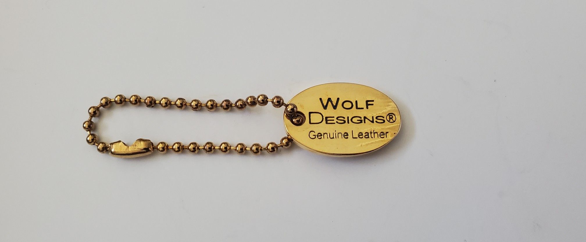 Wolf Designs purse charm hang tag