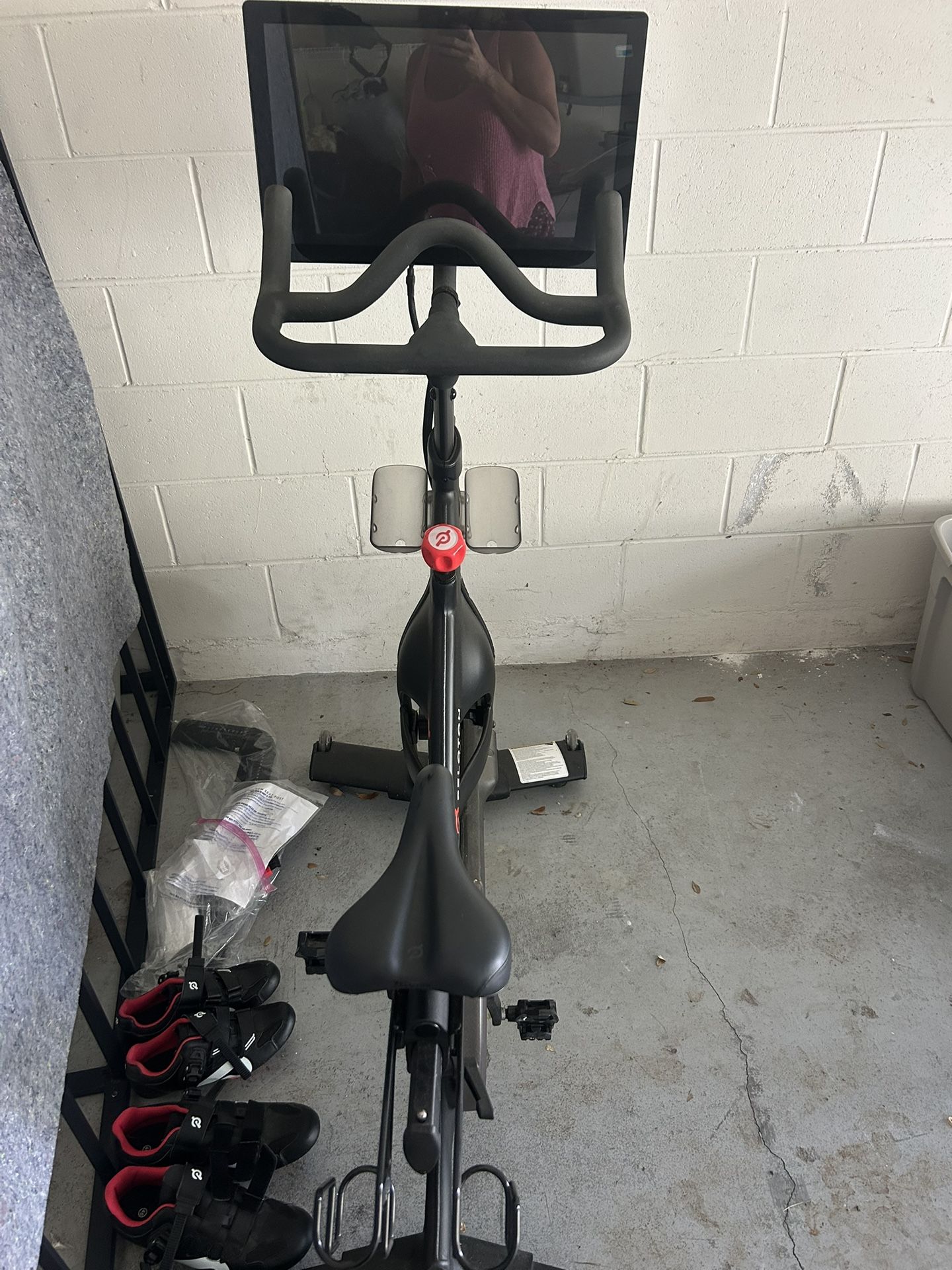 Peloton Bike And Three Sets Of Shoes