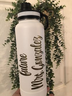 Custom water bottles. Green, white, black and blue available