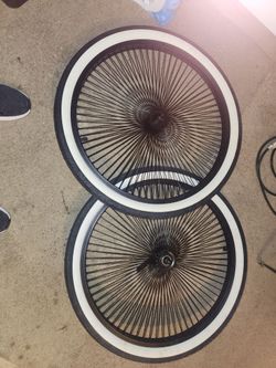 140 spokes with white wall tires