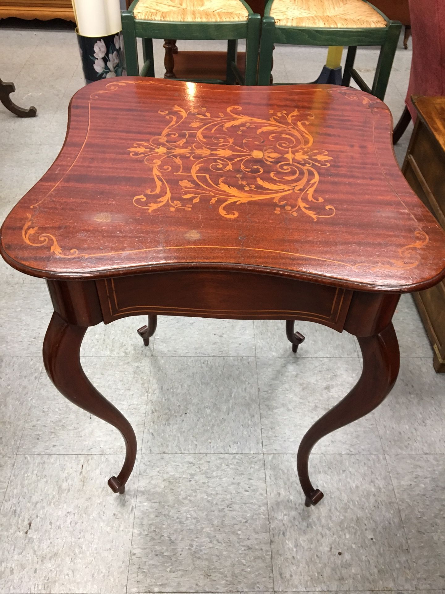 Old mahogany wood table with intricate inlaid