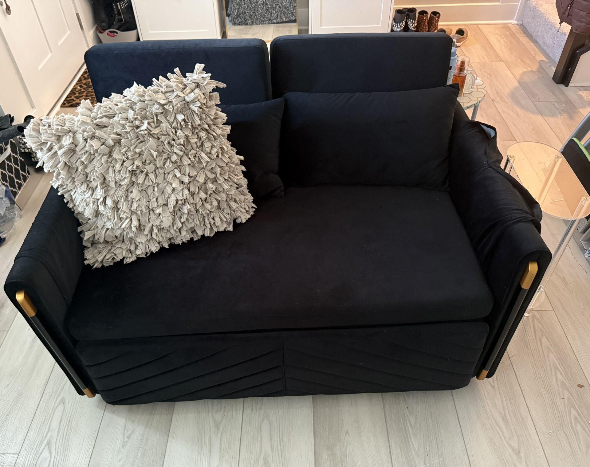 Stylish black Sleeper sofa with gold accents