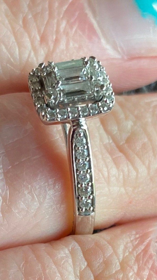 14 K White Gold Emerald Cut Diamond ring.