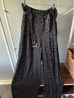 Wide-leg black pants with white polka dots