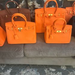 THE ELUSIVE LOCK AND LEATHER HANDBAGS 