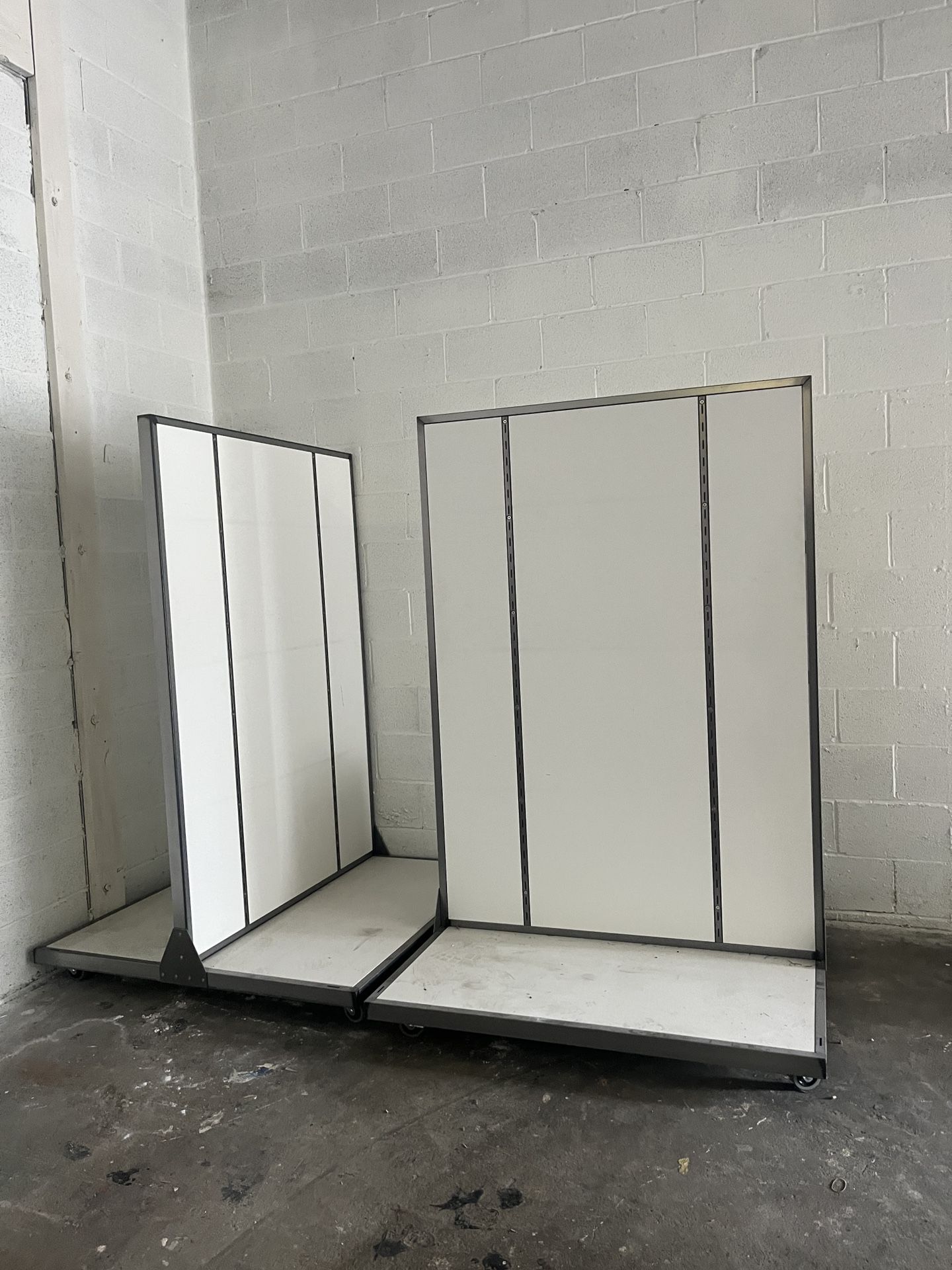 two white grocery store retail furniture shelf equipment movers with wheels