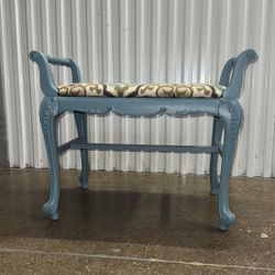 vintage distressed wooden vanity stoop with upholstered seat in light blue, multicolor ikat fabric