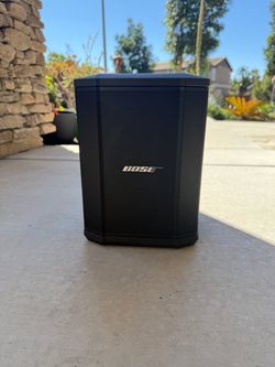 Bose S1 Pro+ All-in-one Powered Portable Bluetooth Speaker Wireless PA System, Black with battery lasting up to 11 hours.
