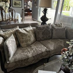 Antique couch with carved wooden frame