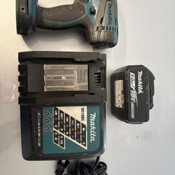 Makita XDT04 Impact Driver with Charger and 18v  5amp Battery 