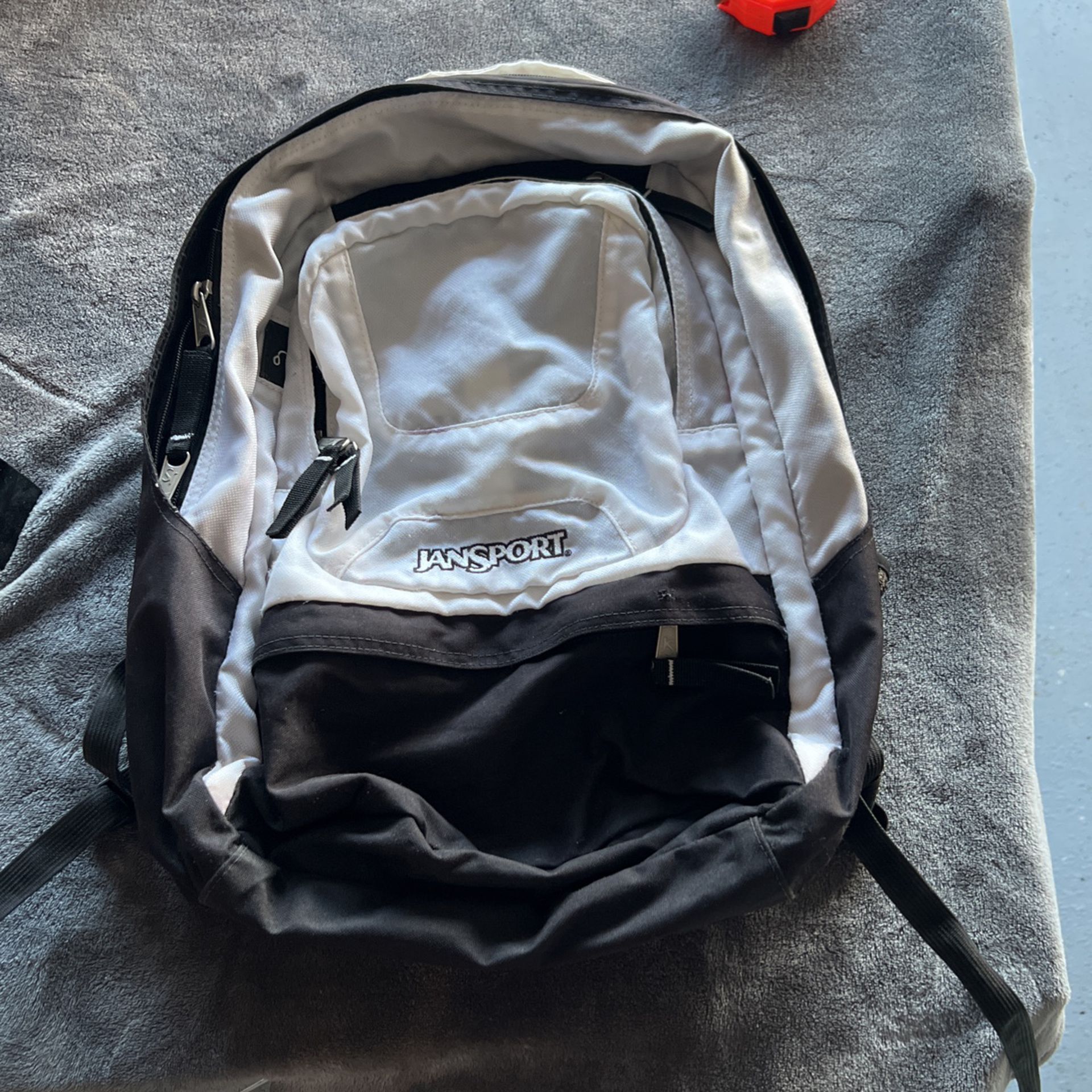 White And Black Jansport Backpack 