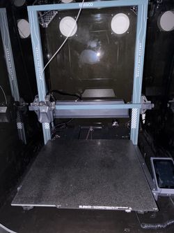 Elegoo Neptune 4 max 3D printer with two ABS filament rolls.