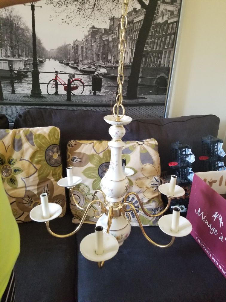 A Golden Chandelier. Good Condition. Made of Solid Brass. A Beautiful Piece for your home.