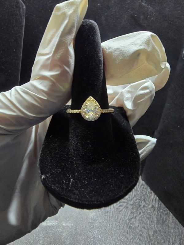 This 10kt gold over 925 silver diamond Moissanite Pear-shaped ring