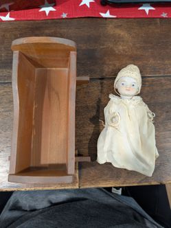 Bisque Baby Doll with Wooden Cradle