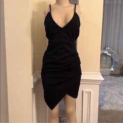 Elegant black sleeveless bodycon dress with a V-neckline. Perfect for a night out.