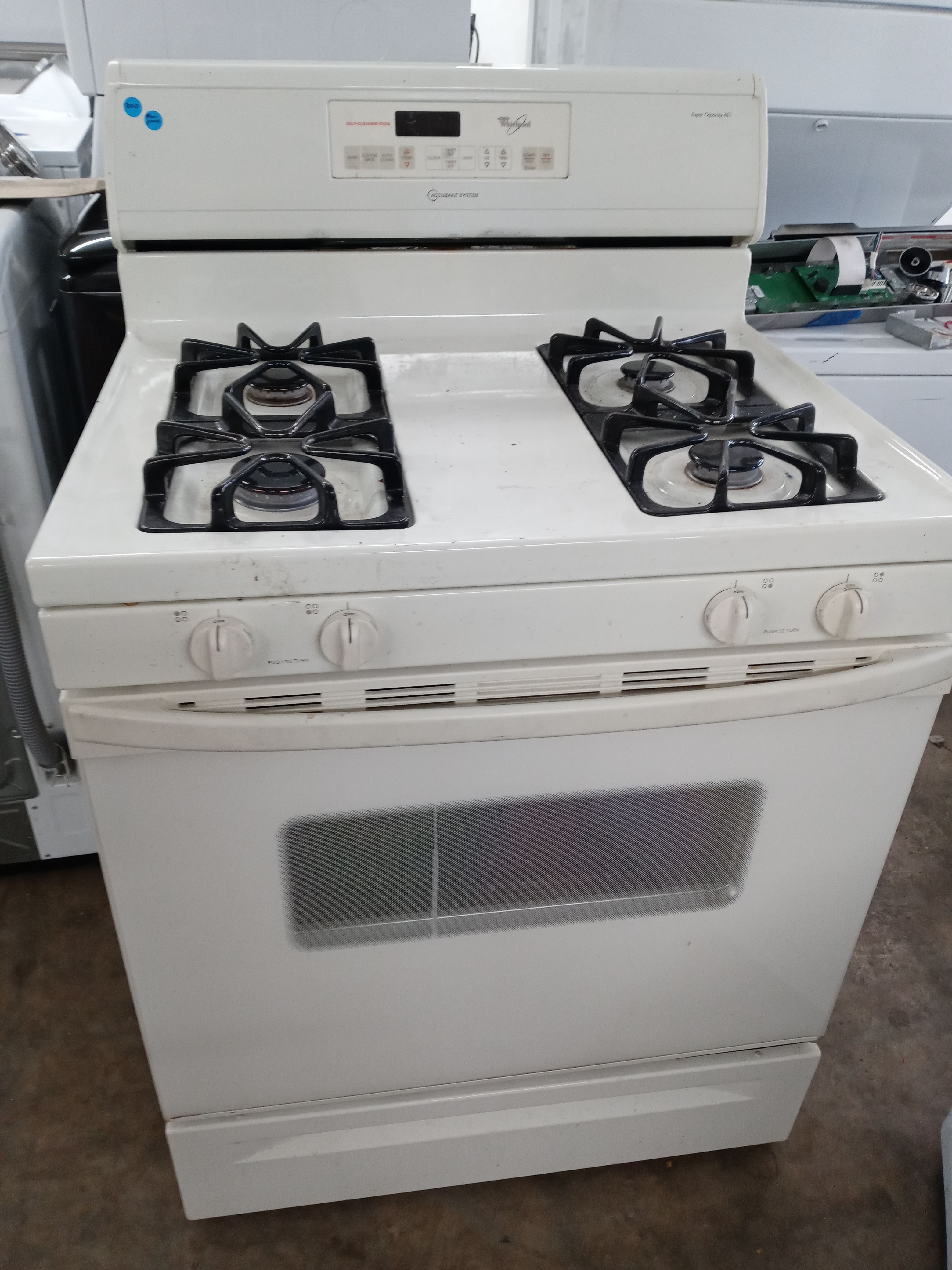 Whirlpool almond 4-burner propane-converted stove - Free delivery