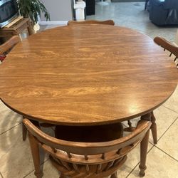 Round Wooden Table With Four Wooden Chairs